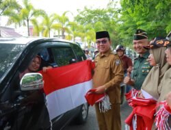Jelang HUT RI ke-79, Pj Bupati Aceh Barat Bagikan 10 Juta Bendera Kepada Masyarakat